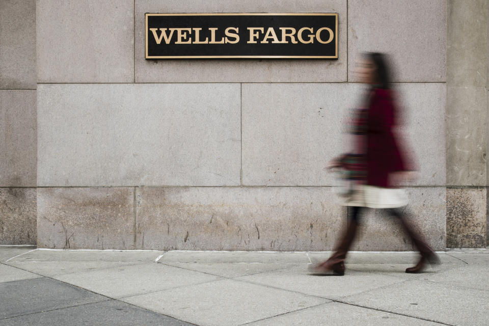 FILE - In this Nov. 29, 2018, file photo shows a Wells Fargo bank location in Philadelphia. Wells Fargo & Co. reports financial results on Tuesday, Jan. 14, 2020. (AP Photo/Matt Rourke, File)