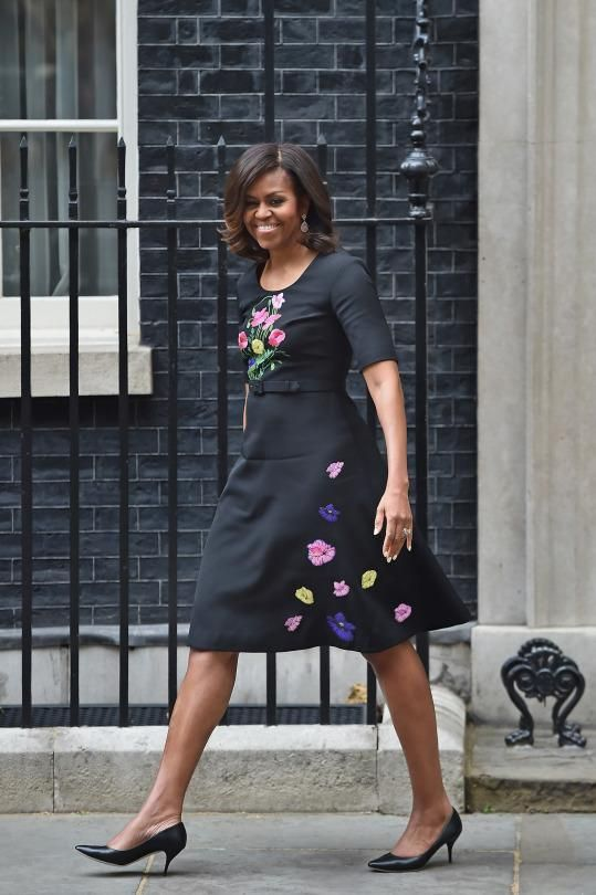 Michelle Obama exiting David Cameron’s office in a black dress. 