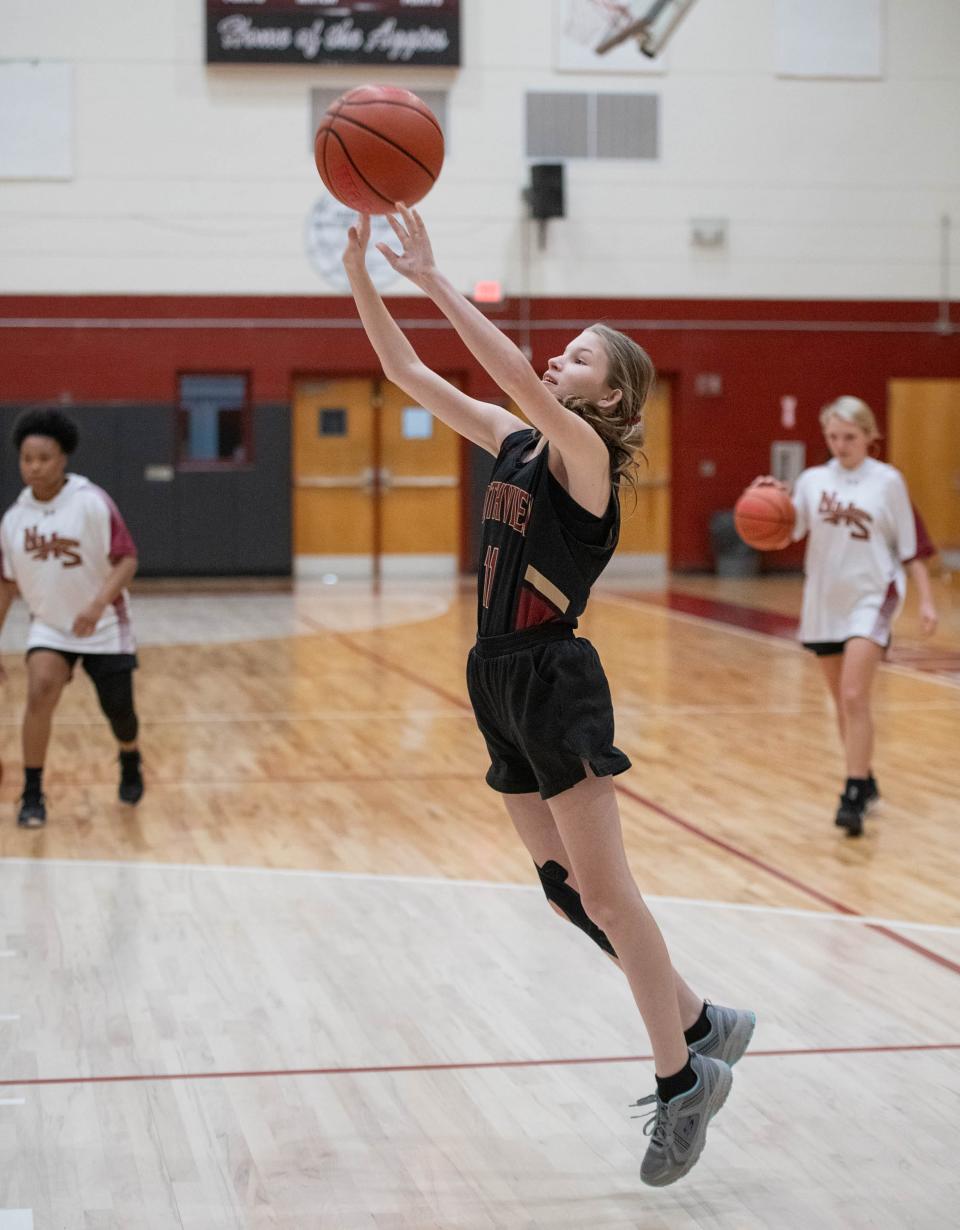 Rose Denham (11) shoots during warmups before the Northview vs Tate girls basketball game at Tate High School in Cantonment on Monday, Dec. 18, 2023.