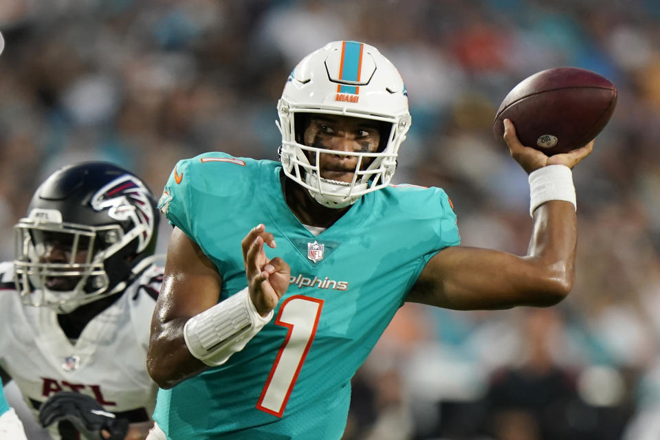 FILE - Miami Dolphins quarterback Tua Tagovailoa (1) looks to pass the ball during the first half of a NFL preseason football game against the Atlanta Falcons in Miami Gardens, Fla., in this Saturday, Aug. 21, 2021, file photo. Continued improvement hinges largely on the development of second-year quarterback Tua Tagovailoa, who has appeared more decisive and aggressive with his throws in training camp. (AP Photo/Wilfredo Lee, File)