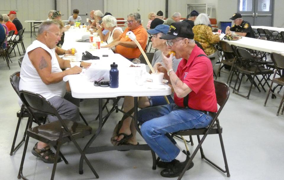 Veterans and others enjoy a meal of bean soup and cornbread at the 2022 Crawford County Fair. The annual meal, served in the Youth Building, is free to all veterans. Others are welcome to dine, but are asked to make a donation.