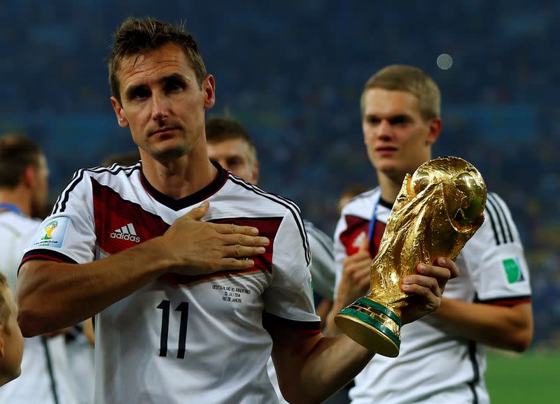 FILE PHOTO: Germany's Klose holds the World Cup trophy after the 2014 World Cup final against Argentina at the Maracana stadium in Rio de Janeiro