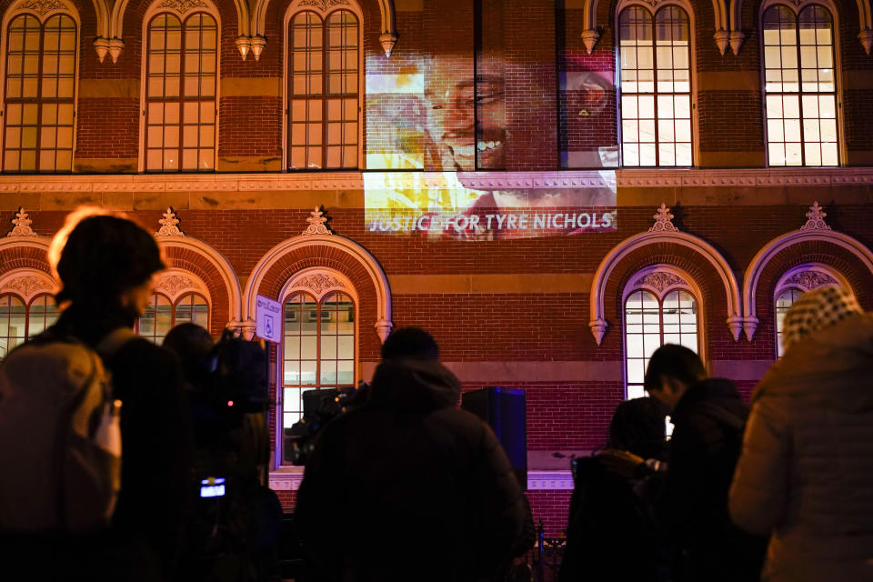 An image of Tyre Nichols, who died after being beaten by Memphis police officers on Jan. 7, is displayed on a building as people gather to protest over his death Friday, Jan. 27, 2023, in Washington. (AP Photo/Carolyn Kaster)