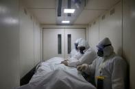 FILE PHOTO: Medical workers take care of the coronavirus disease (COVID-19) patients at a hospital in Moscow