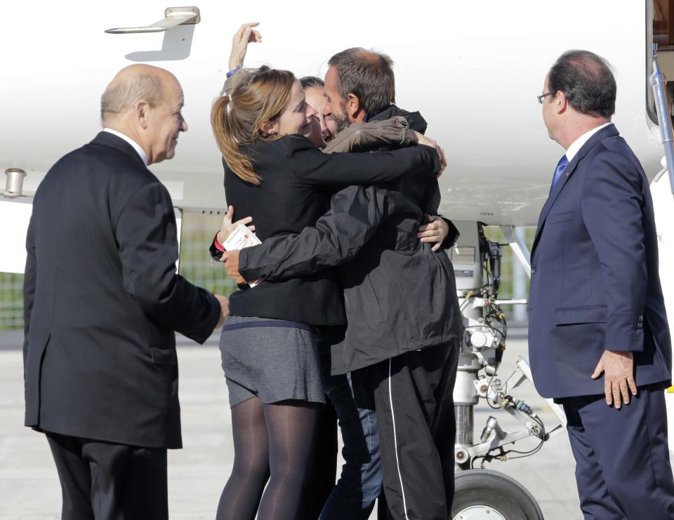 Freed French hostages arrive home