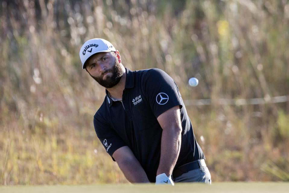 Jon Rahm, of Spain, hits onto the 18th green during the second round of the CJ Cup golf tournament Friday, Oct. 21, 2022, in Ridgeland, S.C. (AP Photo/Stephen B. Morton)