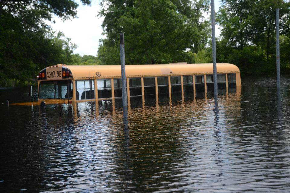 A school bus sits in floodwaters near Pineville, La., in 2015.