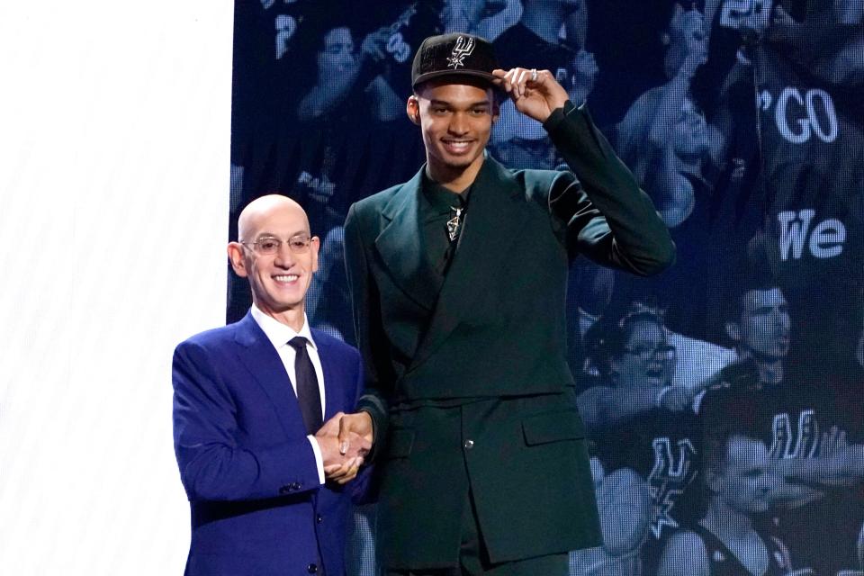 Victor Wembanyama shakes hands with NBA commissioner Adam Silver after being picked by the San Antonio Spurs with the No. 1 overall pick of the 2023 NBA Draft at Barclays Center in New York on June 22, 2023. (Photo by Timothy A. Clary/AFP via Getty Images)