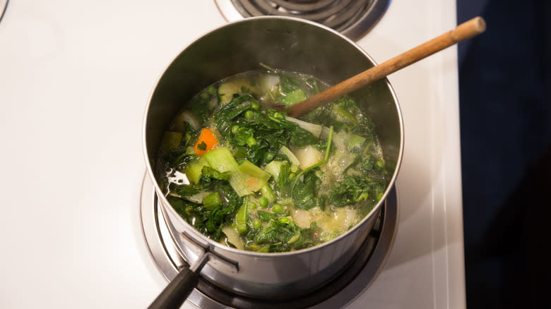 vegetable soup simmering on stove