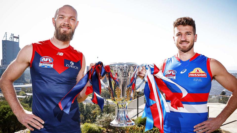 Max Gawn (pictured left) and Marcus Bontempelli (pictured right) hold the AFL grand final trophy.