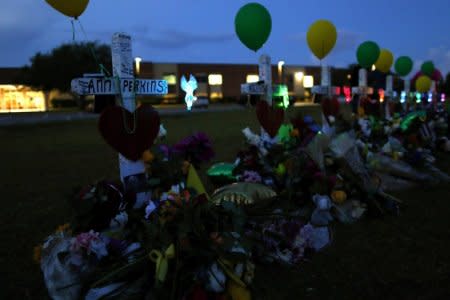 Crosses bearing the names of the victims killed in a shooting at Santa Fe High School are seen in Santa Fe, Texas, U.S., May 21, 2018. REUTERS/Jonathan Bachman