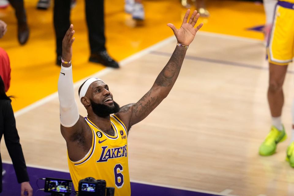 Los Angeles Lakers forward LeBron James celebrates after scoring to pass Kareem Abdul-Jabbar to become the NBA's all-time leading scorer.