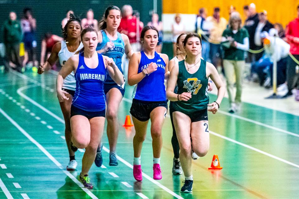 Dighton-Rehoboth's Jaelyn Johnson leads the pack with Wareham's Laura Clement and Fairhaven's Elaine Monroe in the 1000 meter at the SCC Championship at Greater New Bedford.