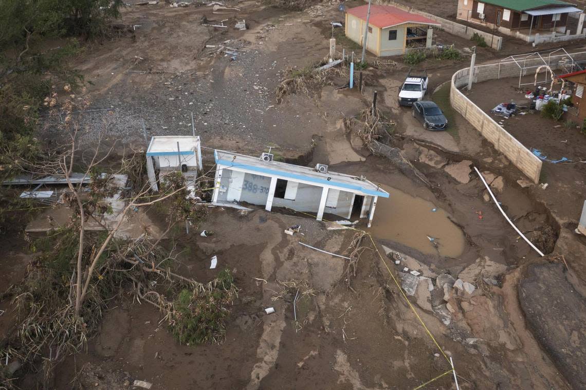 A house rests in the mud after it was washed away by Hurricane Fiona at Villa Esperanza in Salinas, Puerto Rico.