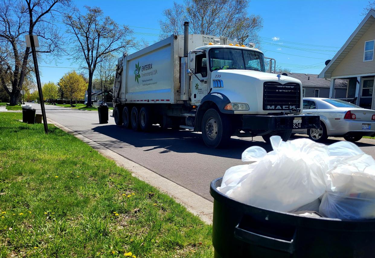 An Emterra Environmental truck makes its way down Minnie Street on Thursday, May 4, 2023, in Port Huron. The city is introducing a $285 fee annually for refuse collection.