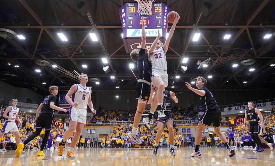 Scottsburg's guard Kody Clancy (32) goes in for a lay-up Saturday, March 16, 2024, during the IHSAA Class 3A semi-state finals at Seymour High School in Seymour. Scottsburg defeated the Guerin Catholic Golden Eagles, 74-50.