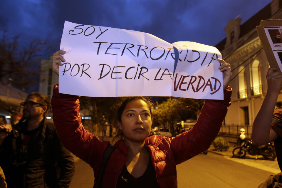A woman holds up the Spanish message: "I'm a terrorist for telling the truth," during a protest against the arrest of WikiLeaks founder Julian Assange, outside the Foreign Ministry in Quito, Ecuador, Thursday, April 11, 2019. On Thursday, Ecuador's President Lenin Moreno allowed British authorities to forcibly remove Assange from Ecuador’s small embassy in London. (AP Photo/Dolores Ochoa)