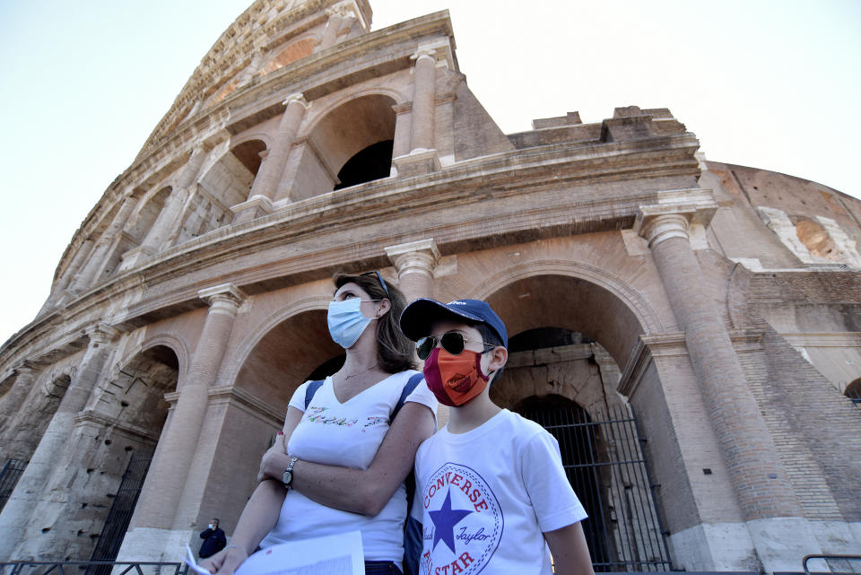 People wearing face masks visit the Colosseum on June 1, 2020, in Rome, after three months of closure due to coronavirus lockdown measures. (Photo: Simona Granati - Corbis via Getty Images)