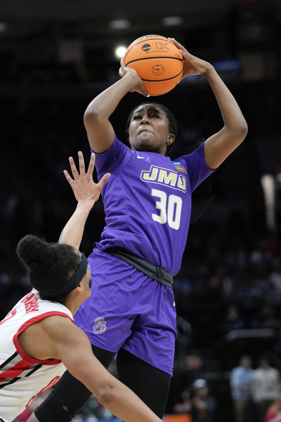 James Madison guard Kiki Jefferson (30) shoots on Ohio State forward Taylor Thierry (2) in the second half of a first-round women's college basketball game in the NCAA Tournament Saturday, March 18, 2023, in Columbus, Ohio. (AP Photo/Paul Sancya)