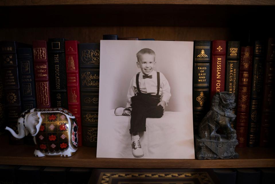 A childhood photograph of Mike Cramer around the age of 8 is seen at his home in Grosse Pointe Woods on Wednesday, April 26, 2023. "I didn't believe it because I didn't really know that much about it," said Cramer, when speaking about his Asperger's self-diagnosis. "Discovering it became a little bit more gradual. I became more aware of it and then I could trace the similar traits that other people had back to my life."