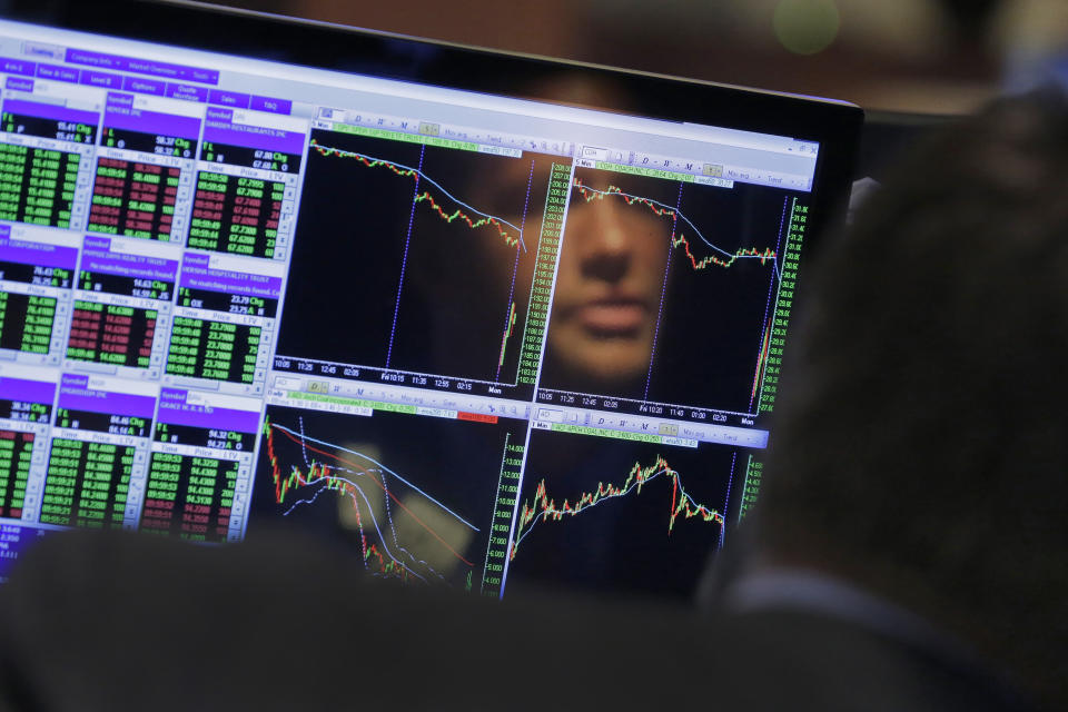 Specialist Frank Masiello is reflected in his screen on the floor of the New York Stock Exchange. (AP Photo/Richard Drew, FIle)