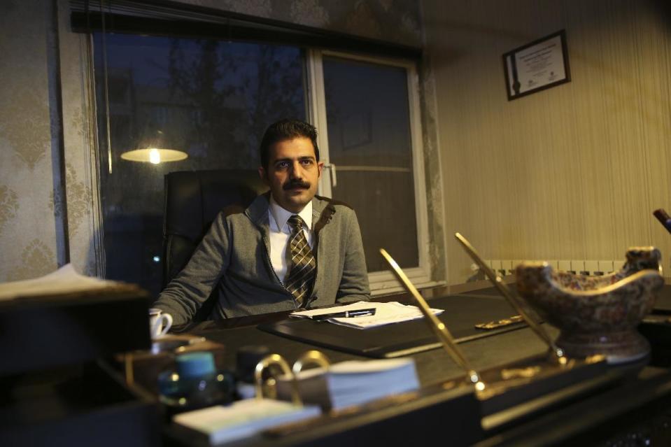 Amir Raisian the lawyer of imprisoned Iranian human rights activist Arash Sadeghi speaks in an interview with The Associated Press at his office in Tehran, Iran, Tuesday, Jan, 3, 2017. Arash Sadeghi ended a 71-day hunger strike Tuesday as his detained wife won a temporary release from prison, a day after his case sparked a rare unauthorized protest in Tehran. Sadeghi's hunger strike began Oct. 24 after authorities arrested his wife to make her serve a six-year sentence over an unpublished fictional story found in her home about a woman burning a Quran in anger over another woman being stoned to death for adultery. (AP Photo/Vahid Salemi)