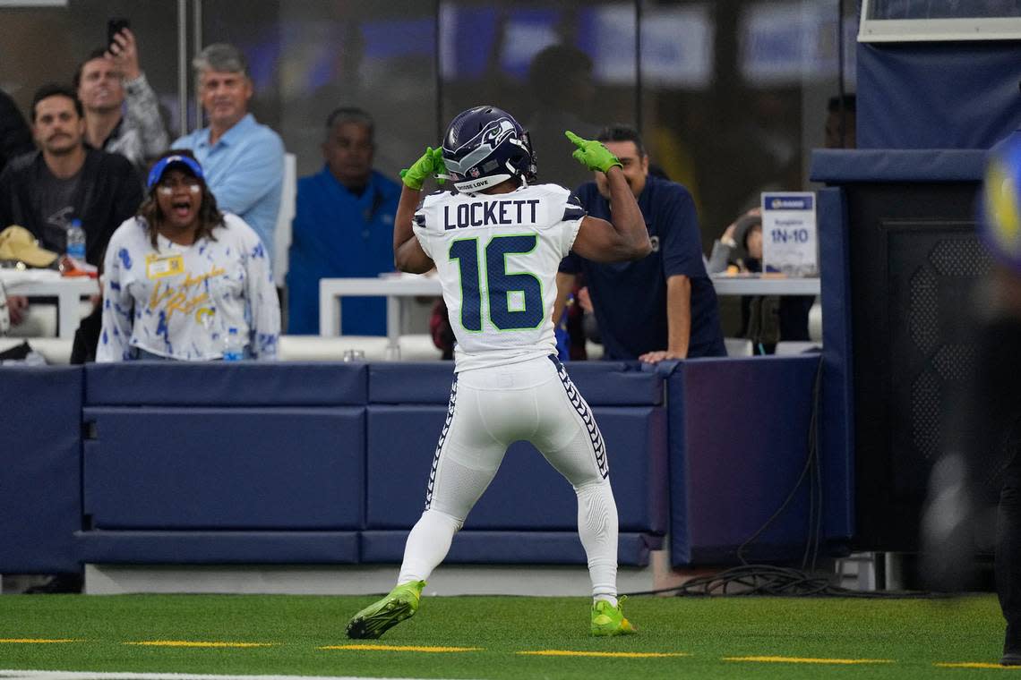 Seattle Seahawks wide receiver Tyler Lockett celebrates after scoring during the first half of an NFL football game against the Los Angeles Rams Sunday, Dec. 4, 2022, in Inglewood, Calif. (AP Photo/Mark J. Terrill)