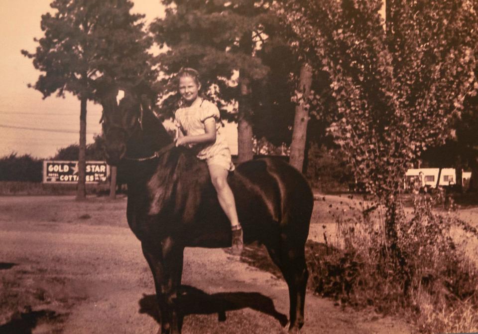 A girl rides her horse through Glenwood in a photo made in the 1930s that is on display at the Springfield History Museum.
