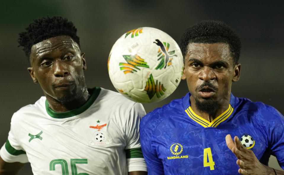 Zambia's Kennedy Musonda, left, and Tanzania's Ibrahim Hamad challenge for the ball during the African Cup of Nations Group F soccer match between Zambia and Tanzania, at the Laurent Pokou stadium in San Pedro, Ivory Coast, Sunday, Jan. 21, 2024. (AP Photo/Themba Hadebe)