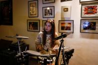 Dananeer Mobeen, a social media influencer who has become famous after her five-second video went viral, plays the drums during an interview with Reuters, in Karachi, Pakistan