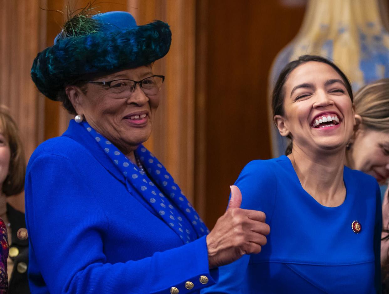 Rep. Alma Adams D-N.C., left, with Rep. Alexandria Ocasio-Cortez, D-N.Y., smiles during an event to advocate for the Paycheck Fairness Act on the 10th anniversary of President Barack Obama signing the Lilly Ledbetter Fair Pay Act, at the Capitol in Washington, Wednesday, Jan. 30, 2019.(AP Photo/J. Scott Applewhite)  