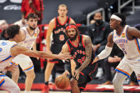 Toronto Raptors' DeAndre Bembry (95) looks to pass the ball under pressure from Oklahoma City Thunder's Lugeuntz Dort (5), Isaiah Roby, left, and Ty Jerome (16) during the first quarter of a basketball game Sunday, April 18, 2021, in St. Petersburg, Fla. (AP Photo/Steve Nesius)