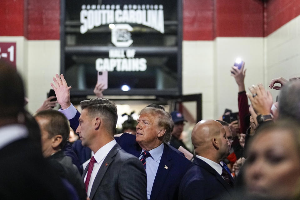 Republican presidential candidate and former President Donald Trump arrives before an NCAA college football game between South Carolina and Clemson, Saturday, Nov. 25, 2023, in Columbia, S.C. (AP Photo/Chris Carlson)