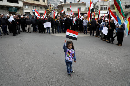 Druze people take part in a rally over U.S. President Donald Trump's support for Israeli sovereignty over the Golan Heights, in Majdal Shams near the ceasefire line between Israel and Syria in the Israeli occupied Golan Heights March 23, 2019 REUTERS/Ammar Awad