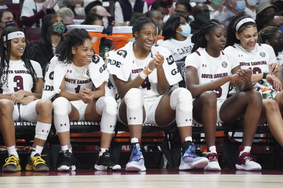 South Carolina guard Destanni Henderson (3), Zia Cooke (1), Aliyah Boston (4), Laeticia Amihere (15) and Kamilla Cardoso, right, watch from the bench during the second half of an NCAA college basketball game against Mississippi Thursday, Jan. 27, 2022, in Columbia, S.C. South Carolina won 69-40. (AP Photo/Sean Rayford)