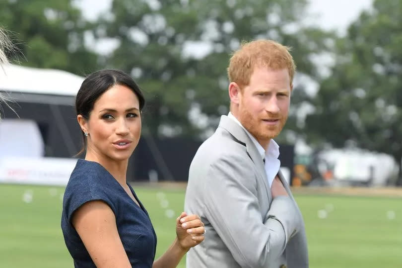 Harry and Meghan looking worried