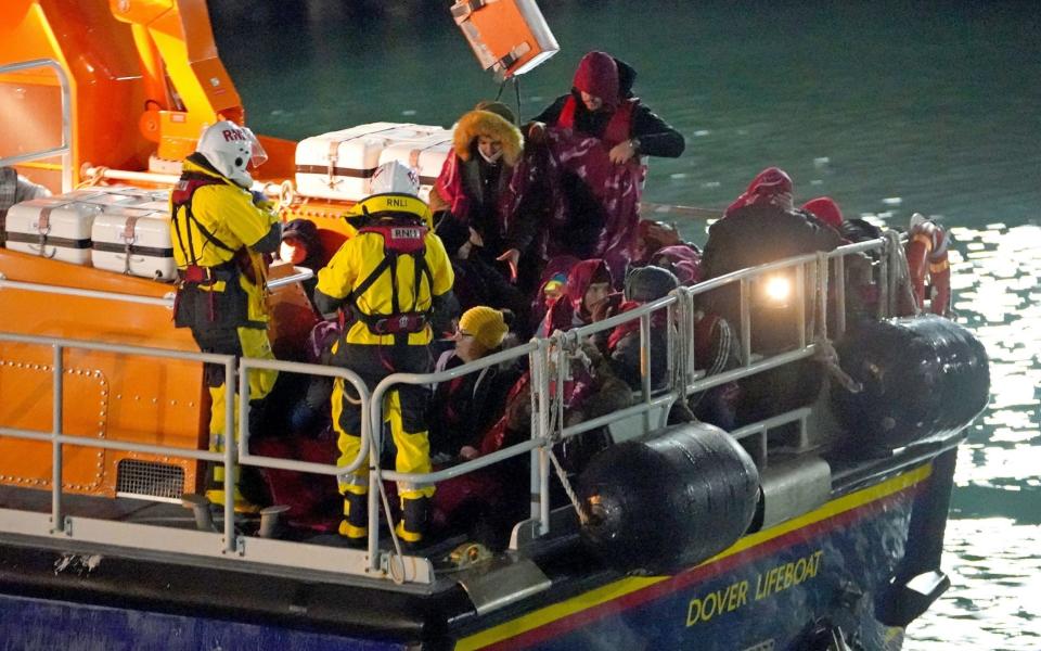 A group of people thought to be asylum seekers were brought into Dover by the RNLI this morning - Gareth Fuller/PA