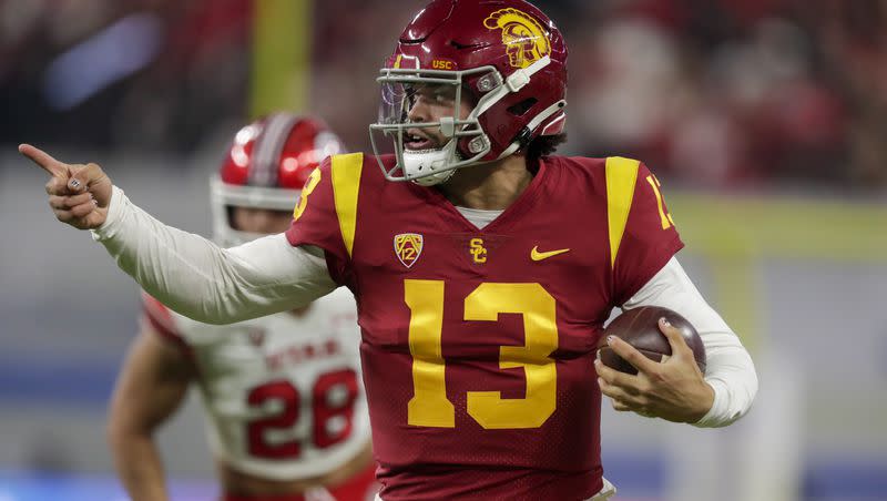 USC QB Caleb Williams points while he runs the ball during Pac-12 championship game against the Utes at the Allegiant Stadium in Las Vegas on Friday, Dec. 2, 2022. The erstwhile Sooner and his coach, Lincoln Riley, left Oklahoma for LaLa Land last year, quickly changing the fortunes of both the USC and Oklahoma programs.