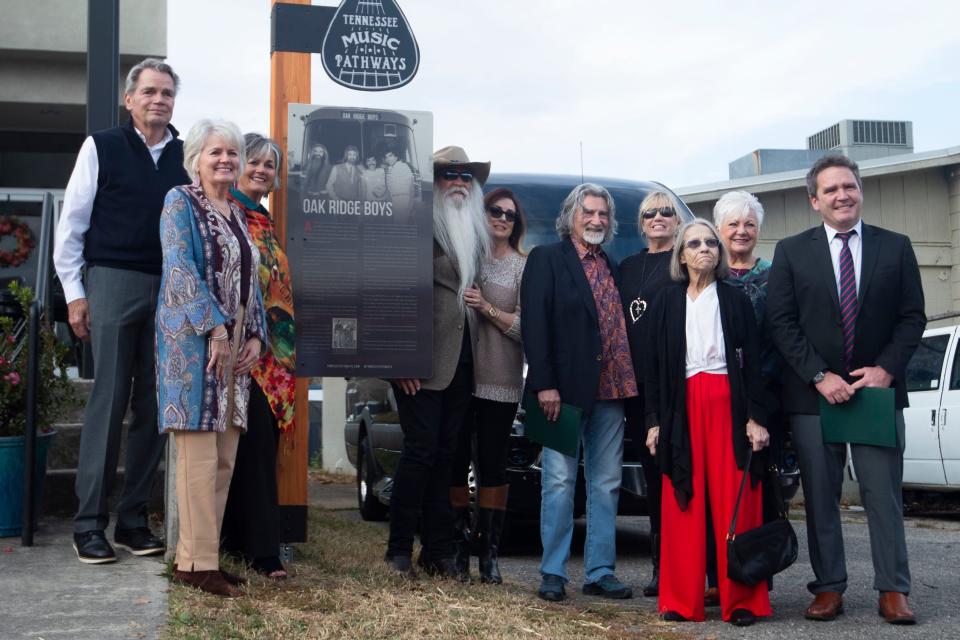 The family of Wally Fowler and Lon "Deacon" Freeman join Richard Sterban and William Lee Golden of the Oak Ridge Boys at a marker recognizing the group. A group called Wally Fowler and the Georgia Clodhoppers performed in 1944 at the Grove Theater.