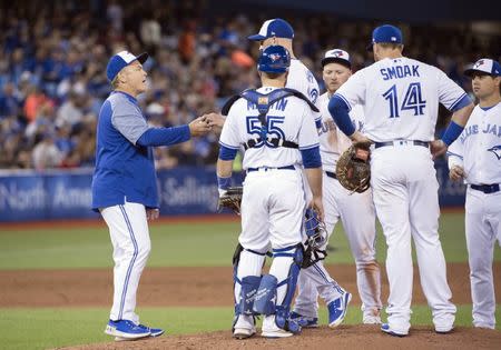 Mar 29, 2018; Toronto, Ontario, CAN; Toronto Blue Jays manager John Gibbons (5) relieves starting pitcher J.A. Happ (33) in the fifth inning during the home opener against the New York Yankees at Rogers Centre. Mandatory Credit: Nick Turchiaro-USA TODAY Sports