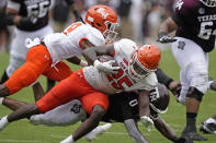 Sam Houston State defensive back B.J. Foster (25) is tackled by Texas A&M wide receiver Ainias Smith (0) after intercepting a pass during the first half of an NCAA college football game Saturday, Sept. 3, 2022, in College Station, Texas. (AP Photo/David J. Phillip)