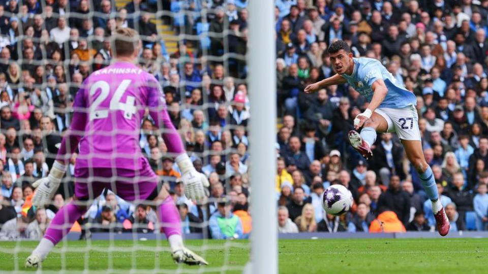 Matheus Nunes shoots at Luton's goal