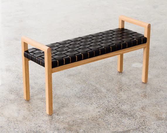 This bench combines a minimalist oak frame with rich woven straps of leather. The bench can easily work for an entryway, bedroom, or even pulled up to the kitchen table. Get it on <a href="https://www.etsy.com/listing/496673374/elegant-modern-wood-framed-bench-with" target="_blank">Etsy</a>.