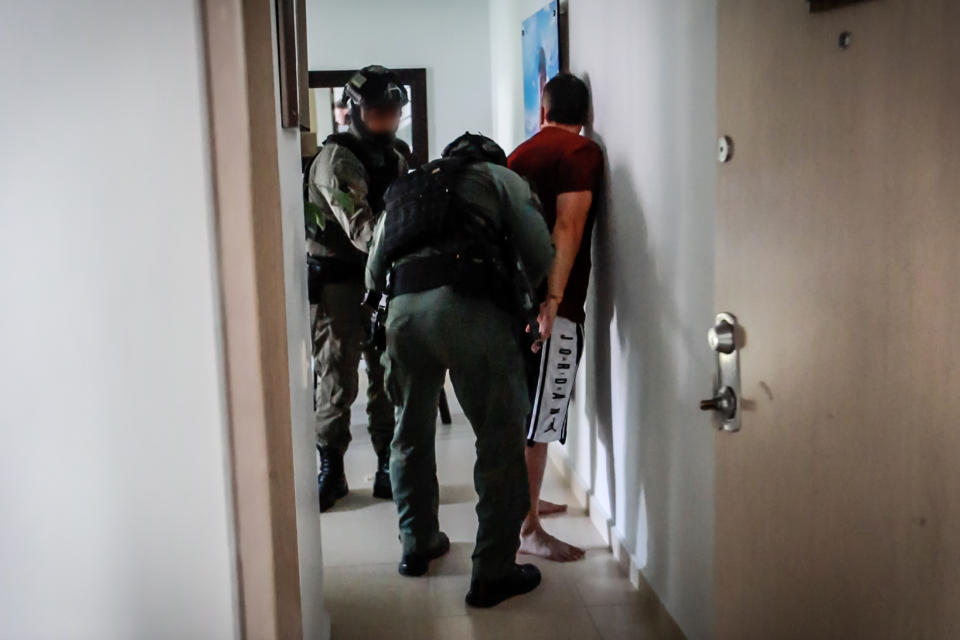 Officers arrest a suspected member of an international drug syndicate. (NBC News)