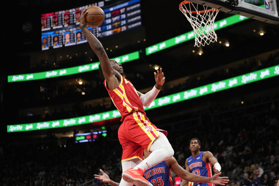 Atlanta Hawks forward Onyeka Okongwu (17) scores against the Detroit Pistons during the second half of an NBA basketball game Monday, Dec. 18, 2023, in Atlanta. (AP Photo/John Bazemore)y