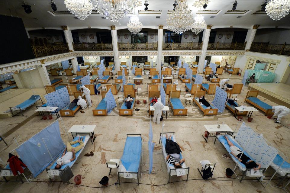 A view of the hall of a restaurant that was converted into a clinic where medical workers help patients suspected of having the coronavirus in Bishkek, Kyrgyzstan, Wednesday, July 22, 2020. Consul, a restaurant in the center of Bishkek, was converted into a night-time clinic to support the country's health care system, struggling with the coronavirus outbreak. (AP Photo/Vladimir Voronin)