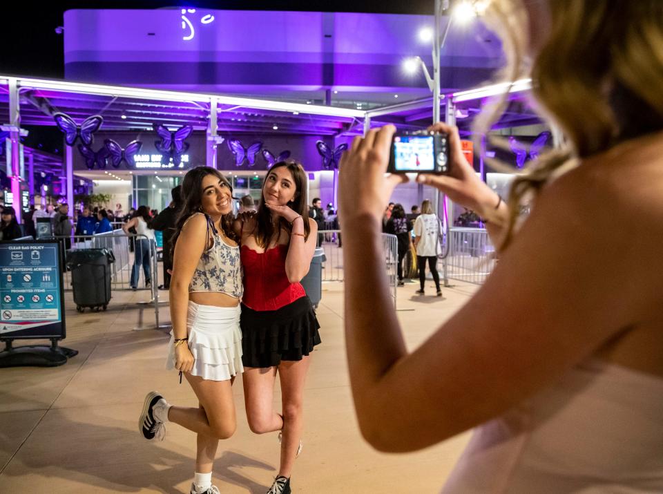 Fans Shaden Alkhairi, 16, and Sage Sigman, 16, of Orange County pose for a photo together before entering to see Olivia Rodrigo during the first stop on the "Guts" tour at Acrisure Arena in Palm Desert, Calif., Friday, Feb. 23, 2024.