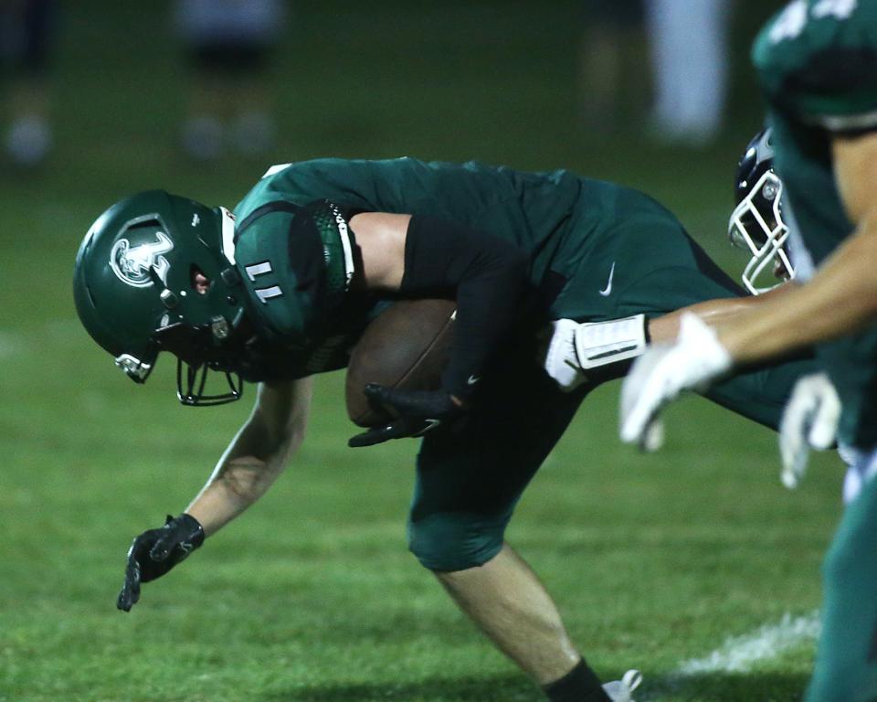 Abington’s Nate Duggan is brought down after getting the interception during second quarter action of their game against Cohasset at Frolio Field on Friday, Sept. 8, 2023. Abington would go on to win 20-7.