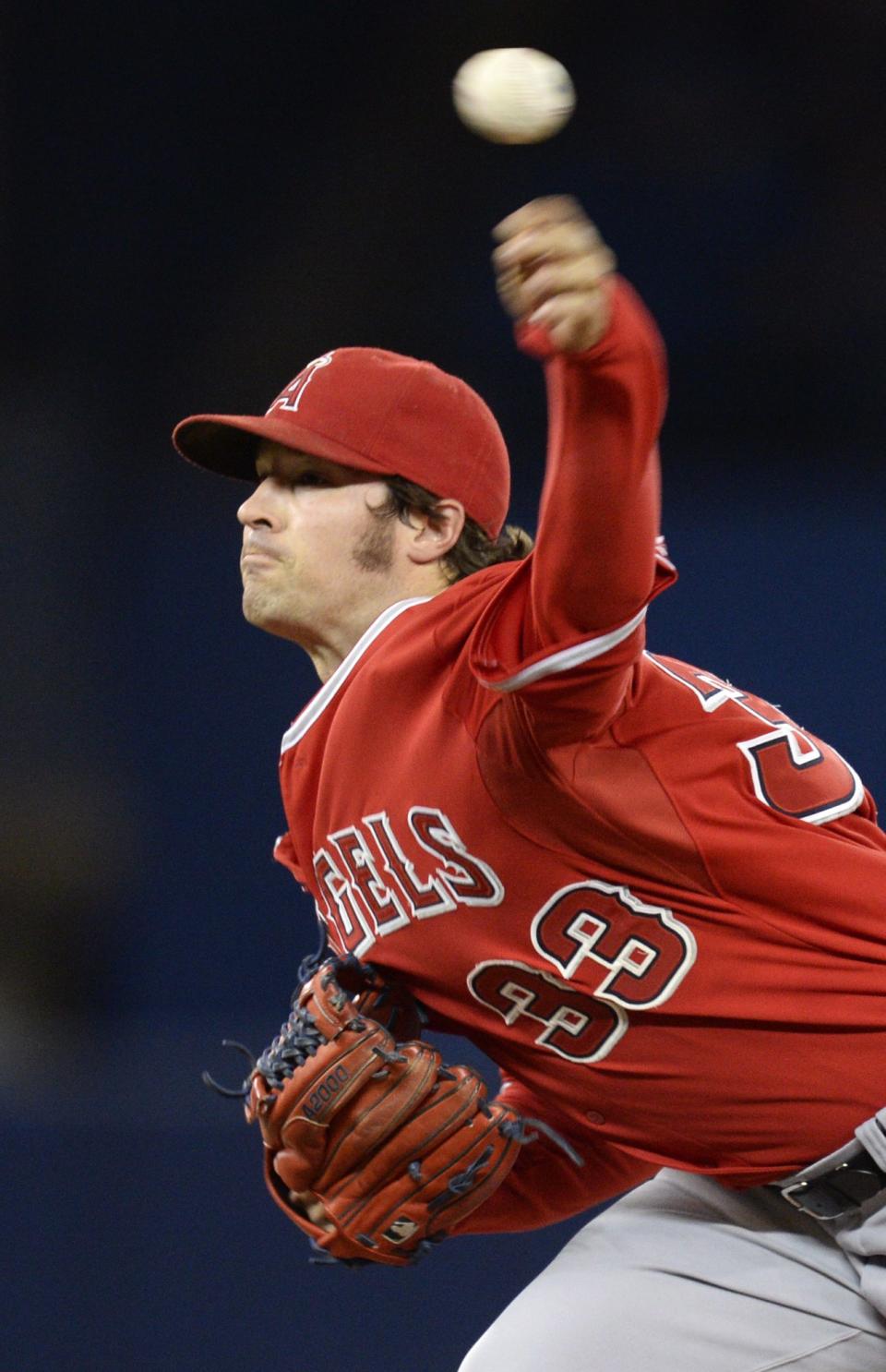 Los Angeles Angels starting pitcher C.J. Wilson pitches against the Toronto Blue Jays during first inning American League baseball action in Toronto on Monday, May 12, 2014. (AP Photo/The Canadian Press, Frank Gunn)