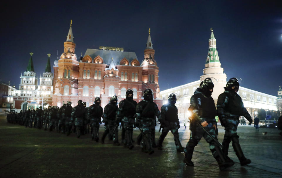 Servicemen of the Russian National Guard (Rosgvardia) gather at the Red Square to prevent a protest rally in Moscow, Russia, Tuesday, Feb. 2, 2021. A Moscow court has ordered Russian opposition leader Alexei Navalny to prison for more than 2 1/2 years on charges that he violated the terms of his probation while he was recuperating in Germany from nerve-agent poisoning. Navalny, who is the most prominent critic of President Vladimir Putin, had earlier denounced the proceedings as a vain attempt by the Kremlin to scare millions of Russians into submission. (AP Photo/Pavel Golovkin)